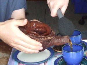 Tea poured from a chocolate tea pot